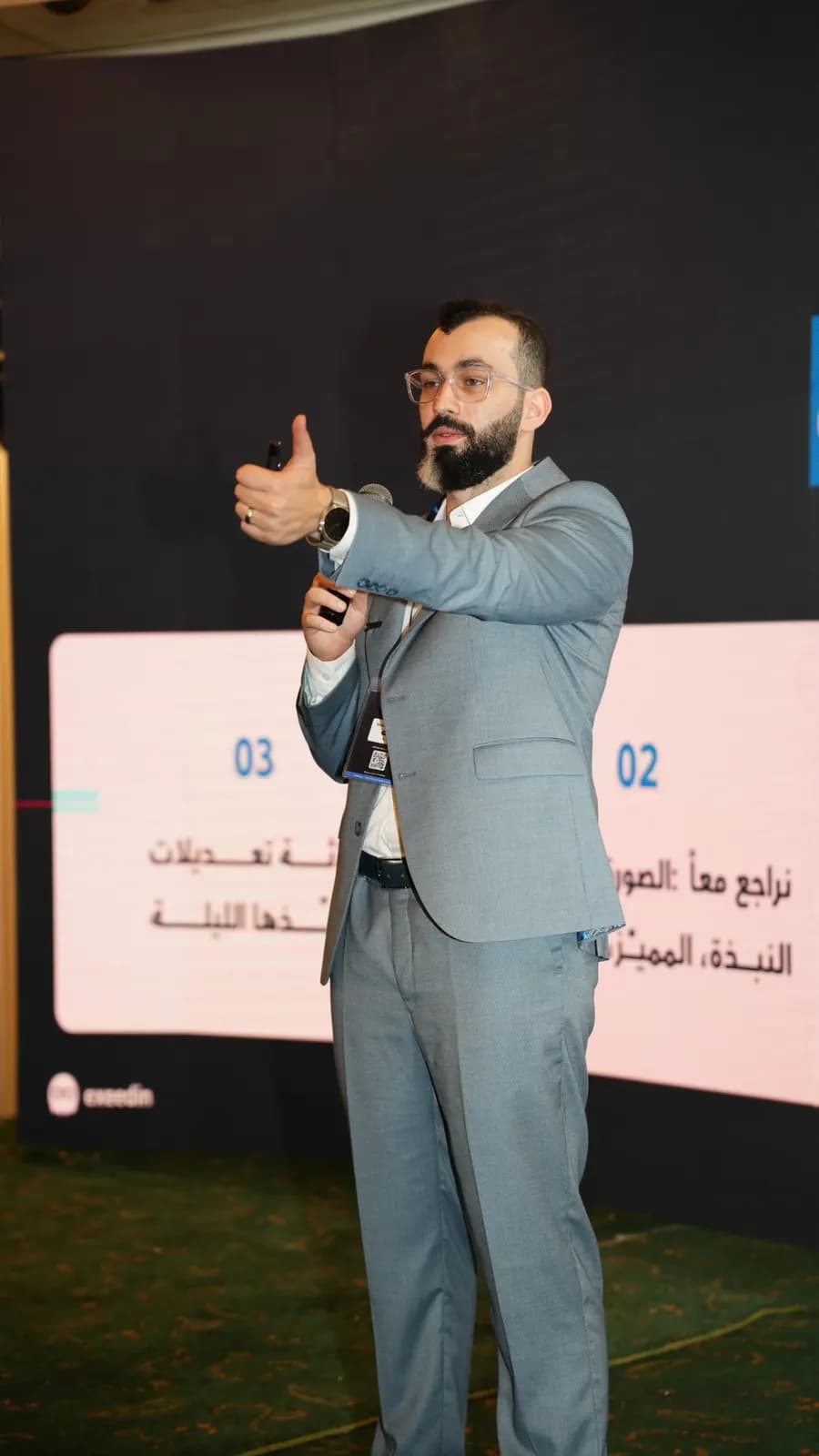 Mohamad Jandali presenting on stage