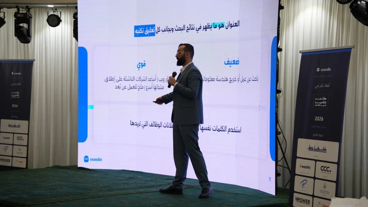 Mohamad Jandali comparing a weak and a strong LinkedIn headline on stage